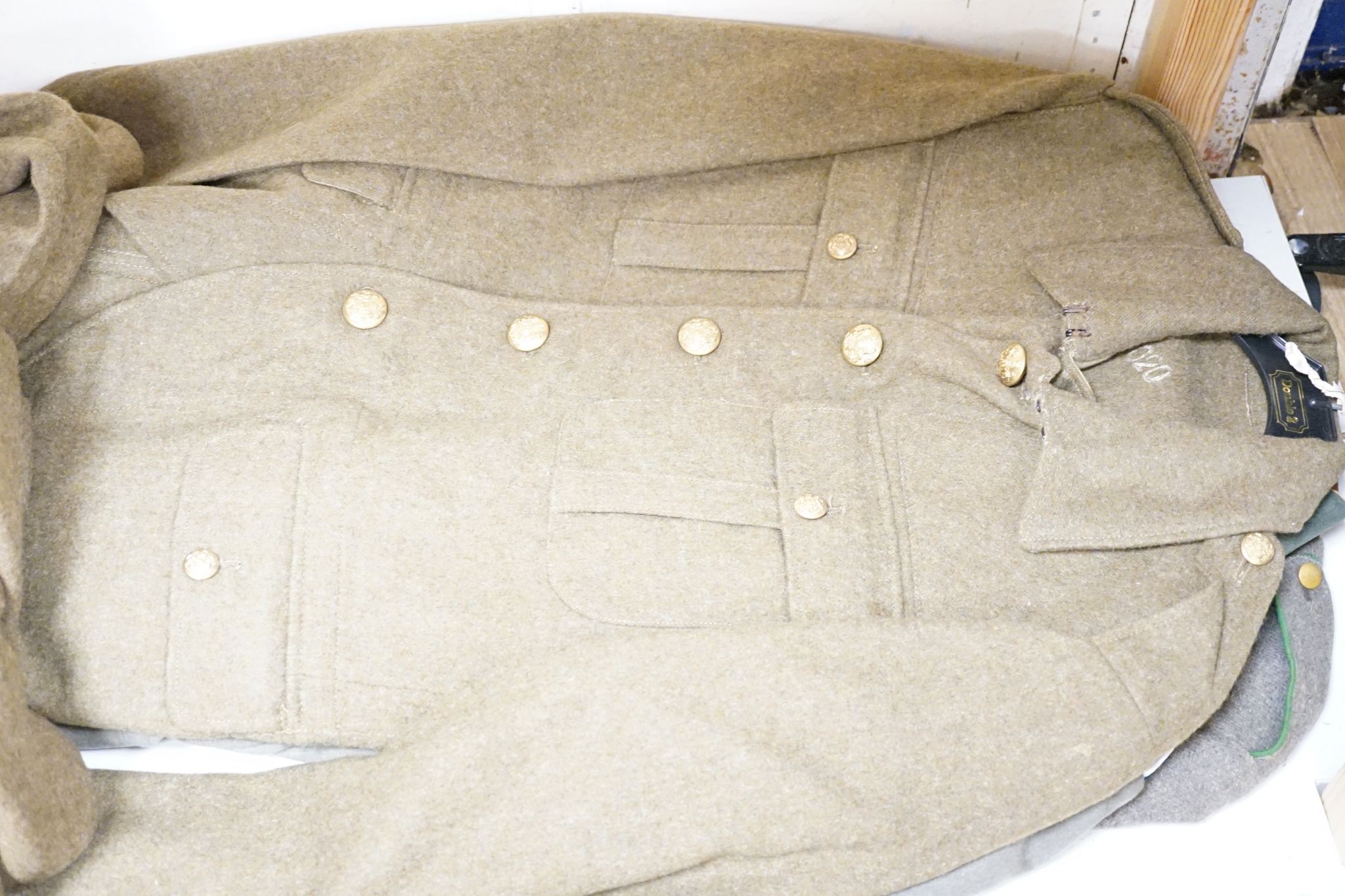 Two German WWI jackets and a similar British jacket.